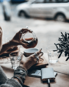 Detailed wireframe and organized code structure overlaid with a partial, highly polished luxury website design, illustrating the concept of the essential foundation beneath the aesthetic facade.